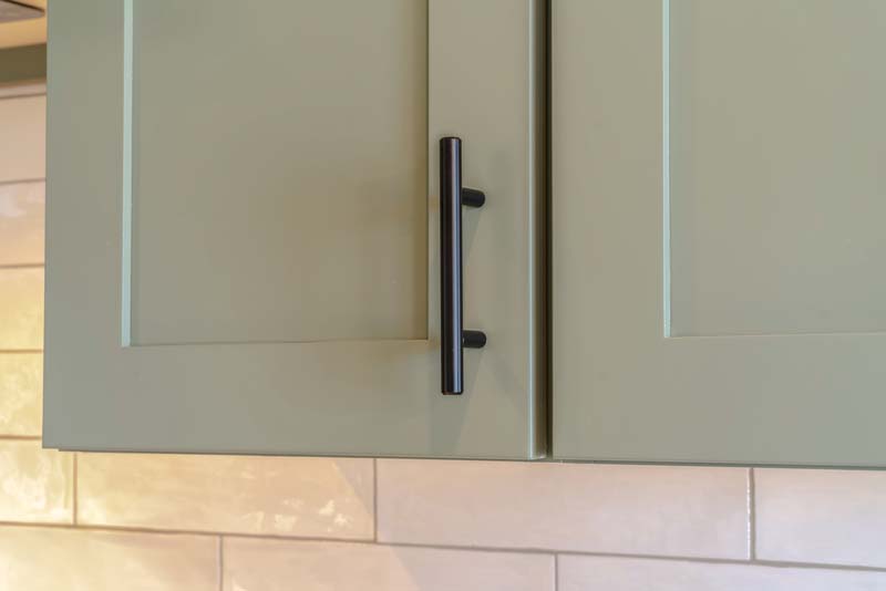 Sage coloured kitchen cabinet door with black handle Nottinghamshire